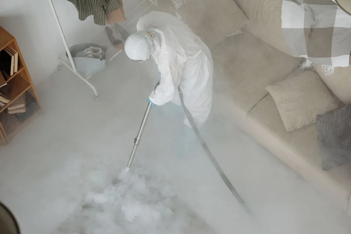 Biohazard cleanup technician in protective equipment, Abbotsford, WI